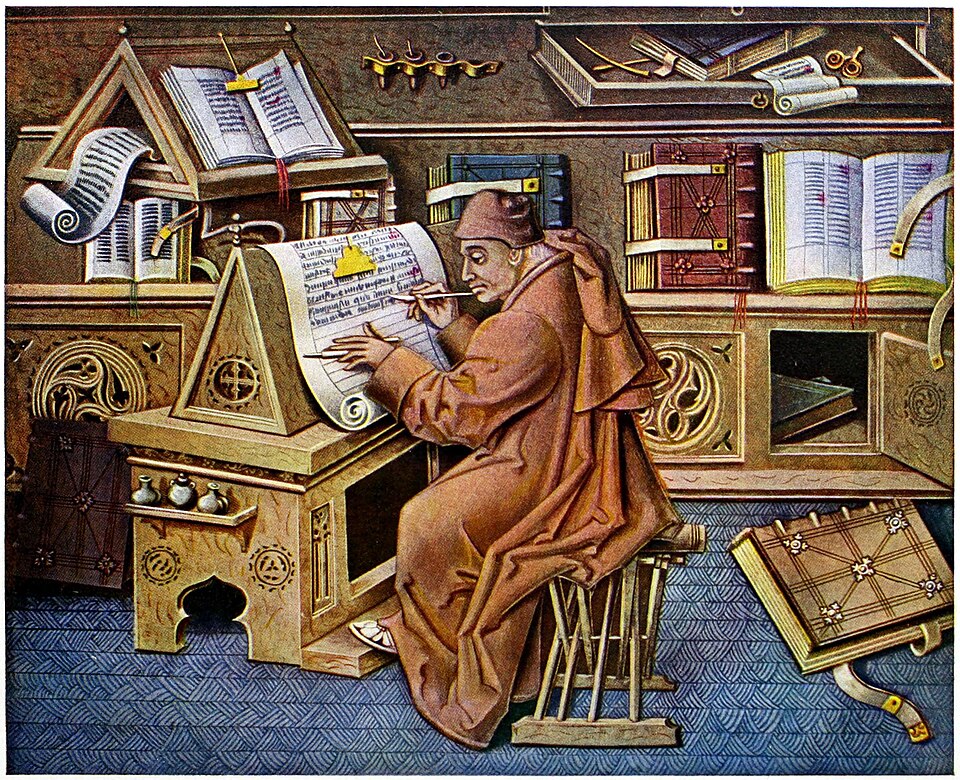 A medieval scribe copying a manuscript by hand